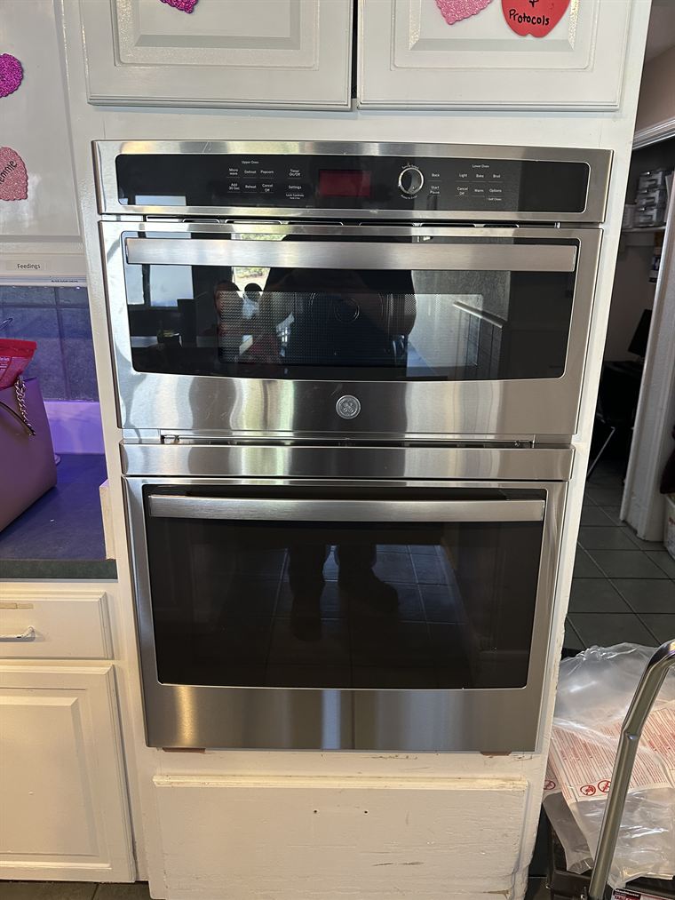 New stainless wall oven and microwave in the same cabinet