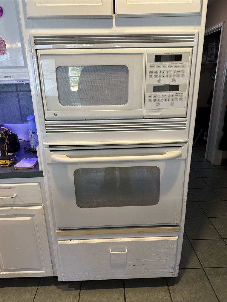 Old wall oven and microwave unit before removal